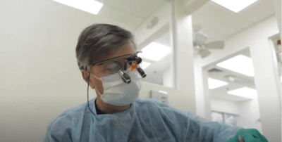 Dentist using technological equipment to improve his vision