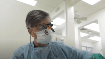 Dentist using technological equipment to improve his vision