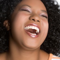 Woman with Curly Hair Laughing 