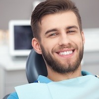Portrait Of Happy Patient In Dental Chair